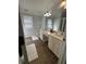 Double vanity bathroom with light wood floors at 1958 Stonewood Dr, Lithia Springs, GA 30122