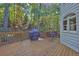 Deck with wooded views, grill, and small seating area at 1620 Silverleaf Way, Alpharetta, GA 30005