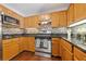 Stainless steel appliances and wood cabinets highlight this kitchen at 1570 Oakdale Rd, Canton, GA 30114