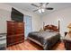 Bedroom with a queen-size bed, dresser, and hardwood floors at 3336 Henson Ln, Stockbridge, GA 30281