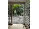 View of brick patio through a white lattice gate at 263 Mountainview Cir, Canton, GA 30115