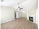 Bright living room with hardwood floors, fireplace, and vaulted ceiling at 208 Beckman St, Palmetto, GA 30268