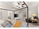 Main bedroom with a large bed, seating area and en-suite bathroom access at 2536 Skyland Ne Dr, Atlanta, GA 30319