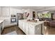 Open concept kitchen with white cabinets, granite island and stainless steel appliances at 2536 Skyland Ne Dr, Atlanta, GA 30319
