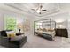 Main bedroom with a large bed, seating area, and plenty of natural light at 2536 Skyland Ne Dr, Atlanta, GA 30319