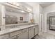 Double vanity bathroom with granite countertops and large mirror at 2536 Skyland Ne Dr, Atlanta, GA 30319