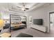 Luxurious main bedroom featuring a large bed, TV, and sitting area at 2536 Skyland Ne Dr, Atlanta, GA 30319