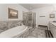 Bathroom with a large soaking tub, walk-in shower, and granite countertops at 2536 Skyland Ne Dr, Atlanta, GA 30319