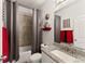 Bathroom with tub shower combination, granite vanity, and gray tile at 2536 Skyland Ne Dr, Atlanta, GA 30319