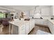 Open concept kitchen with white cabinets and large island at 2536 Skyland Ne Dr, Atlanta, GA 30319