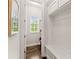 Bright laundry room with built-in bench and window at 2536 Skyland Ne Dr, Atlanta, GA 30319