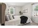 King sized bed in a spacious bedroom with large window at 2527 Swan Lake Dr, Grayson, GA 30017
