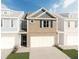 Two-story brick townhome with attached garage at 2527 Swan Lake Dr, Grayson, GA 30017