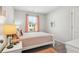 Bright bedroom with double bed, window, and closet at 2527 Swan Lake Dr, Grayson, GA 30017