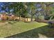 Large backyard with a wooden fence and a grill at 6300 Phillips Ct, Lithonia, GA 30058