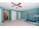 Bedroom with bunk beds, teal walls, and plush carpet at 436 Westlake Dr, Marietta, GA 30064