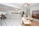 Open concept kitchen and dining area with white cabinets, stainless steel appliances, and tile floors at 436 Westlake Dr, Marietta, GA 30064