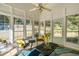 Bright sunroom with large windows, wicker furniture, and a view of the backyard at 436 Westlake Dr, Marietta, GA 30064