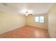 Spacious bedroom with hardwood floors and ceiling fan at 3884 Wood Path Dr, Stone Mountain, GA 30083