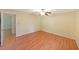 Bedroom with hardwood floors and access to another room at 3884 Wood Path Dr, Stone Mountain, GA 30083