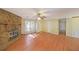 Living room with stone fireplace and hardwood floors at 3884 Wood Path Dr, Stone Mountain, GA 30083