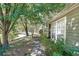 Sidewalk view of house exterior and landscaping at 3884 Wood Path Dr, Stone Mountain, GA 30083
