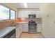 Bright kitchen features stainless steel appliances and ample counter space at 3884 Wood Path Dr, Stone Mountain, GA 30083