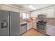 Kitchen with stainless steel appliances and white cabinets at 3884 Wood Path Dr, Stone Mountain, GA 30083