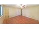 Bright bedroom with wood flooring, ceiling fan, and private bathroom access at 3884 Wood Path Dr, Stone Mountain, GA 30083