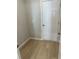 Small laundry room with washer, dryer, and shelving at 8194 Tiger Way, Riverdale, GA 30247