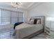 Bright bedroom with large window and modern decor at 3334 Peachtree Ne Rd # 1209 1210, Atlanta, GA 30326