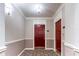 Residential hallway with red doors and patterned carpet at 3334 Peachtree Ne Rd # 1209 1210, Atlanta, GA 30326