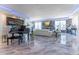 Elegant living room with marble floors, fireplace, and grand piano at 3334 Peachtree Ne Rd # 1209 1210, Atlanta, GA 30326
