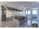 Primary bedroom with a plush bed, marble floors, and stunning city views at 3334 Peachtree Ne Rd # 1209 1210, Atlanta, GA 30326