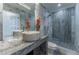 Elegant bathroom featuring a marble sink, large shower, and patterned tile floor at 3334 Peachtree Ne Rd # 1209 1210, Atlanta, GA 30326