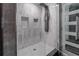 Spa-like shower with marble tile, multiple shower heads, and built-in shelves at 3334 Peachtree Ne Rd # 1209 1210, Atlanta, GA 30326