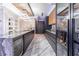 Modern kitchen with dark cabinetry, granite countertops, and wine cooler at 3334 Peachtree Ne Rd # 1209 1210, Atlanta, GA 30326