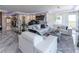 Luxurious living room with white leather sofas and a grand piano at 3334 Peachtree Ne Rd # 1209 1210, Atlanta, GA 30326