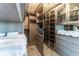 Bright walk-in closet with custom built-ins and drawers at 3334 Peachtree Ne Rd # 1209 1210, Atlanta, GA 30326