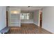 Spacious living room with built-in shelving and hardwood floors at 6851 Roswell Rd # O9, Atlanta, GA 30328