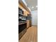 Modern kitchen with stainless steel appliances and wood flooring at 6851 Roswell Rd # O9, Atlanta, GA 30328