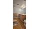 Double vanity bathroom with light wood cabinets, a modern toilet and wood-look flooring at 6851 Roswell Rd # O9, Atlanta, GA 30328