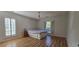 Well-lit bedroom featuring hardwood floors and plantation shutters at 6851 Roswell Rd # O9, Atlanta, GA 30328
