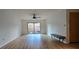 Living room with hardwood floors, sliding doors, and a bench at 6851 Roswell Rd # O9, Atlanta, GA 30328