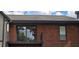 Brick building with balcony and sliding glass doors at 6851 Roswell Rd # O9, Atlanta, GA 30328
