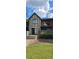 Brick building with balcony and landscaping at 6851 Roswell Rd # O9, Atlanta, GA 30328