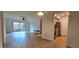 Open concept living room and kitchen area with hardwood floors at 6851 Roswell Rd # O9, Atlanta, GA 30328