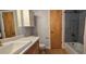 Updated bathroom with gray tile and wood flooring at 6851 Roswell Rd # O9, Atlanta, GA 30328