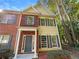 Brick and vinyl-sided townhome with a gray door at 20 Pine Canyon Sw Dr # 24, Atlanta, GA 30331