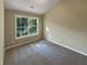 Well-lit bedroom with carpet flooring and a large window at 20 Pine Canyon Sw Dr # 24, Atlanta, GA 30331